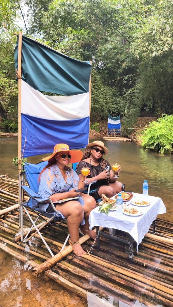Bamboo rafting with Sierra Leone flag